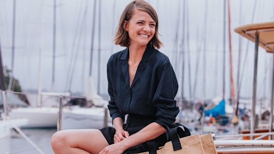 Sailor Jess Watson with a new Oroton bag on board the Oroton Drumfire which she’ll be sailing on during this year’s Sydney to Hobart Yacht race.