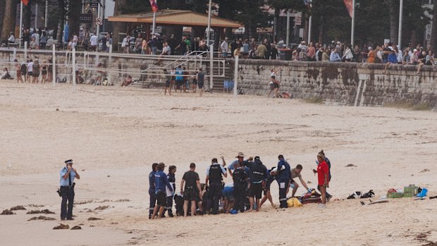 First responders performed CPR on the man while beachgoers watched from the foreshore.