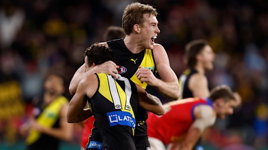 Tom Lynch celebrates the win with Tigers teammates.