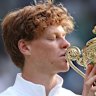Jannik Sinner kisses the famous trophy.