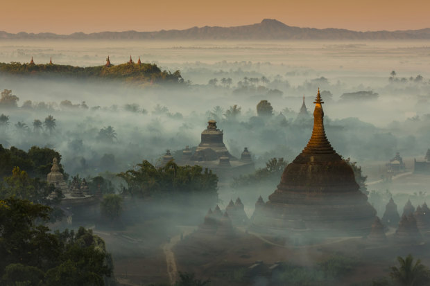 The temples and pagodas of misty Mrauk U, an archeological site in western Burma. Scenes of temples among misty hills are among the sights that had drawn tourists to Myanmar, largely uncharted since colonisation ended.  