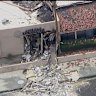 Debris covers the ground after an explosion on Saturday, May 17, 2025 in Palm Springs, Calif.  (ABC7 Los Angeles via AP)