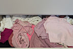 Having shirts folded the standard way in piles wasn't functional and ended up in a mess trying to find specific tops.