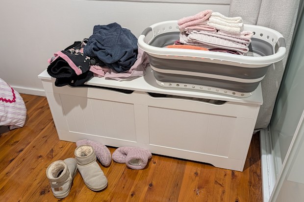 Washing basket and clothes on storage box