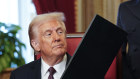 Donald Trump at the signing ceremony on Tuesday (AEDT). His speech this time round carried far more specific actions.