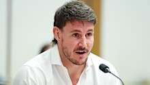 Luke Bateman giving evidence to a gambling inquiry.