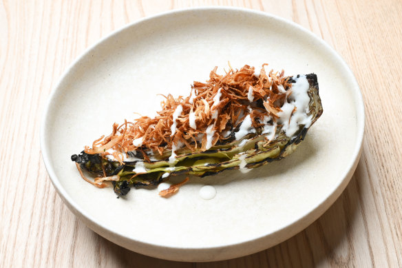 Braised then grilled sugarloaf cabbage with smoked yoghurt and fried shallots.