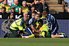 Mo Toure receives medical attention.