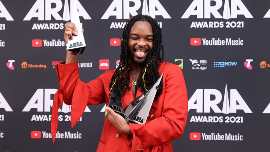Genesis Owusu poses with his four ARIA Awards.