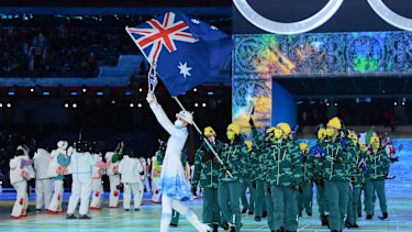 Flag bearers Brendan Kerry and Laura Peel of Australia carry their flag during the opening ceremony. 