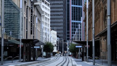 Sydney's George street is deserted with many shops shut and people working from home. At what point is it time to restart the economy again?