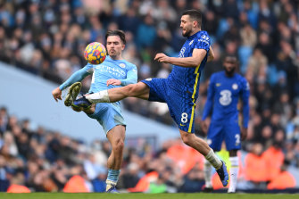Jack Grealish, left, of Manchester City is tackled by Mateo Kovacic of Chelsea. 