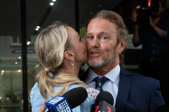 Craig McLachlan is kissed by his partner, Vanessa Scammell, after a not guilty verdict in his sexual assault trial. 