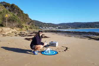 Volunteer scientist Karina Sorrell at Lorne with a drone used to take  3D images of Victoria's coastline. 