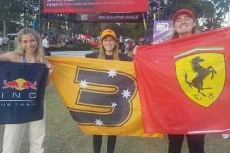Grand Prix supporters out in force: Queenslanders Dan Lucas and Grace and Claudia Freeman.