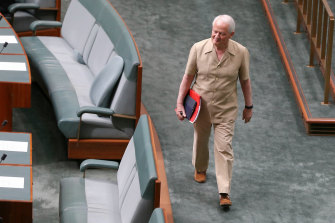 Liberal MP Philip Ruddock enters the chamber for question time in his safari suit in 2015.