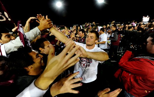 Glory days: Kieran Foran celebrates a premiership with Sea Eagles fans in 2011.