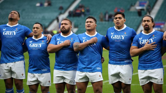 Samoa players sign their national anthem.