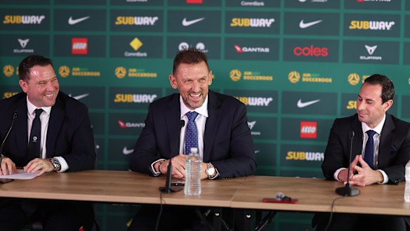 Tony Popovic (centre) at his appointment as Socceroos coach in September, with Football Australia chief executive James Johnson (left) and Isaac.