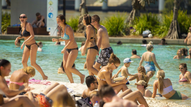 Crowds gather to escape the heat at Streets Beach, South Bank Parklands, Brisbane, on Friday. South-east Queensland is experiencing unseasonably hot conditions for this time of year, with temperatures hitting the high 30s across the region. 