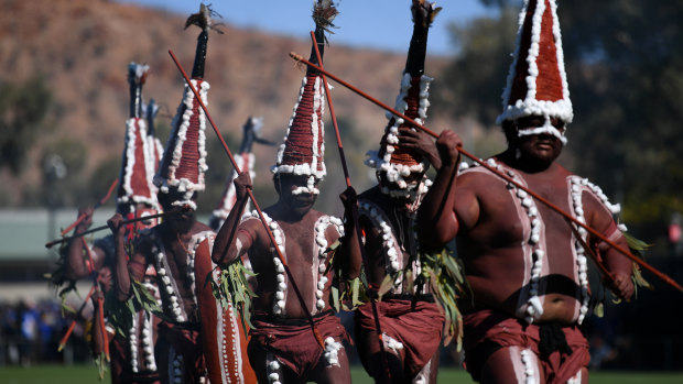 Ceremonial: Indigenous dancers perform before the start of round 18 in the Red Centre.