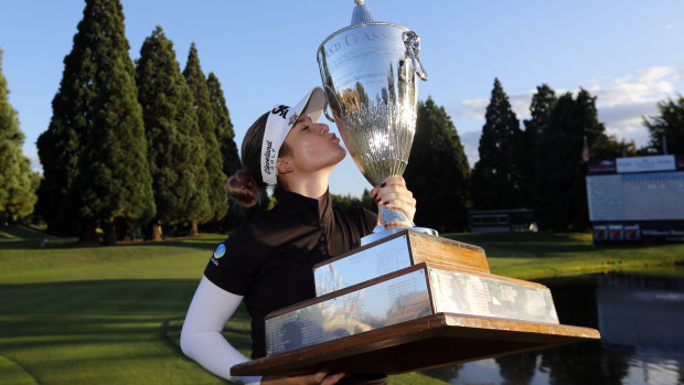 Hannah Green poses with the oversized trophy after winning the Portland Classic.
