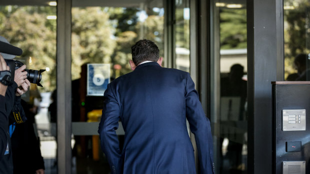 Premier Daniel Andrews entering the back entrance of Victorian Parliament on Thursday.