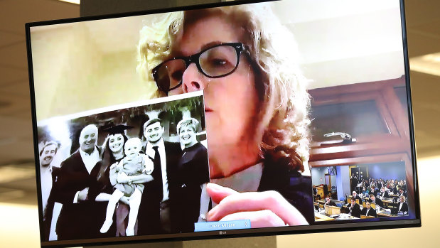Grace's mother Gillian Millane holds a family photograph during her televised victim impact statement from her home in the UK. 