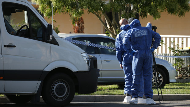 Officers established a crime scene at the Lonus Avenue house after the fatal home invasion.