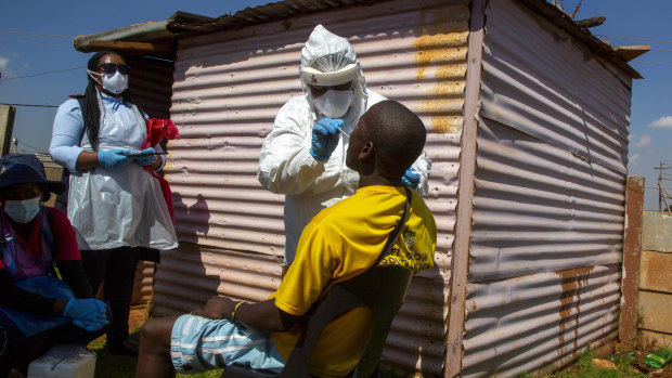 A man is tested for the COVID-19 virus in Johannesburg, South Africa where the rollout of the Oxford- AstraZenaca vaccine has been stopped.