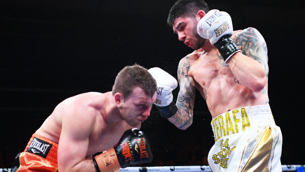 Duck and cover: Michael Zerafa lands a punch on Jeff Horn during their Australian Middleweight bout at Bendigo Stadium.