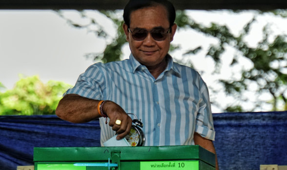 On course for victory: Prayut Chan-o-cha casts his vote on Sunday.