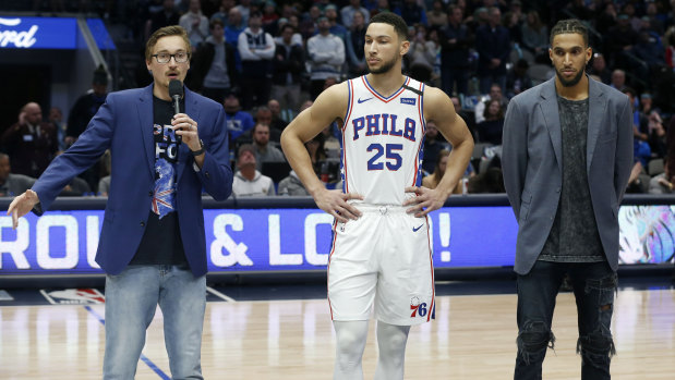 Rallying for relief: Mavericks guard Ryan Broekhoff, left, Philadelphia 76ers guard Ben Simmons (25) and 76ers forward Jonah Bolden, right, encourage fans to donate to an Australian bushfire charity fund, prior to their NBA game in Dallas.