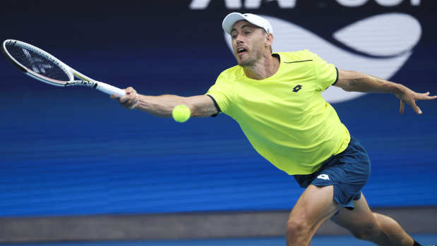 Australia’s John Millman makes a forehand return to Spain’s Pablo Carreno Busta during their ATP Cup match on Tuesday.