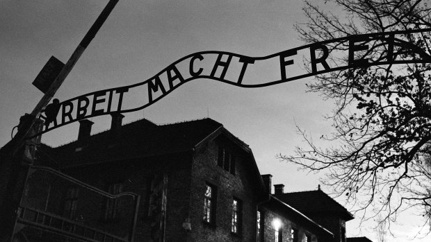 The main entrance at the former Nazi death camp of Auschwitz in Oswiecim, Poland, with the inscription, “Arbeit Macht Frei”, which translates into English as “Work sets you Free”.