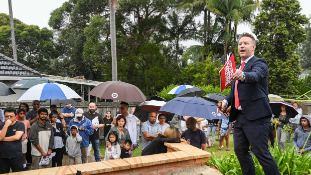 Auctioneer Stu Benson, pictured at a busy auction early last year, has seen a big pullback in buyer competition. 