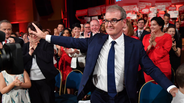 NSW Labor leader Michael Daley waves to the crowd as he leaves the NSW Labor Party election campaign launch in Revesby on Sunday. 