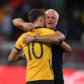 Graham Arnold and Ajdin Hrustic celebrate Australia’s World Cup qualification after beating Peru on penalties.