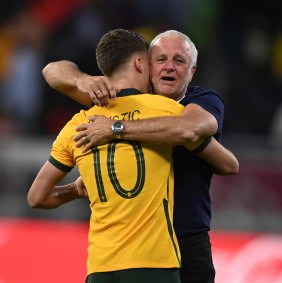 Graham Arnold and Ajdin Hrustic celebrate Australia’s World Cup qualification after beating Peru on penalties.