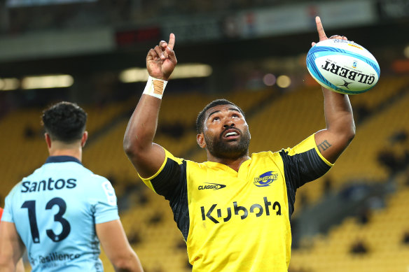Kini Naholo of the Hurricanes celebrates his try.
