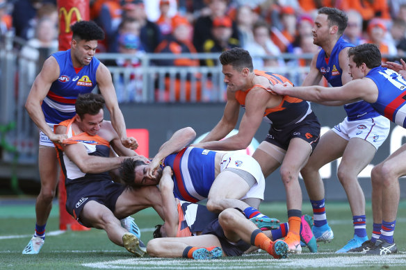Tug of war: The first half was tightly contested, but the Giants kicked away in the third term.