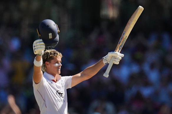 Jacob Bethell celebrates his maiden first-class century on day four of the fifth Ashes Test at the SCG.
