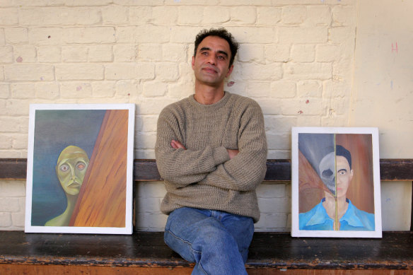 Ardeshir Gholipour with two of his works during a 2005 exhibition at Melbourne’s Trades Hall. 
