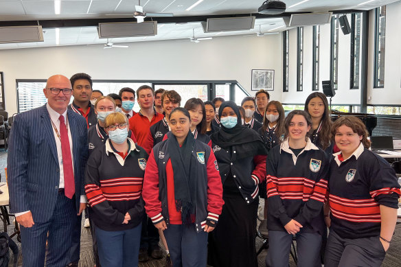 Year 12 students from the failed Colmont School, who had their first day at Ivanhoe Grammar School on Monday, pictured with principal Gerard Foley.