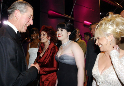 Prince Charles shares a joke with actress Barbara Windsor (right) and Kelly Osbourne (centre) as Kelly's mother Sharon Osbourne looks on at the London Coliseum in 2004.