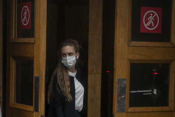 A woman exiting a metro station in Moscow, where COVID cases are rising at record rates. 