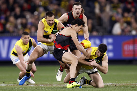 Trent Cotchin and Dylan Shiel battle for the ball.