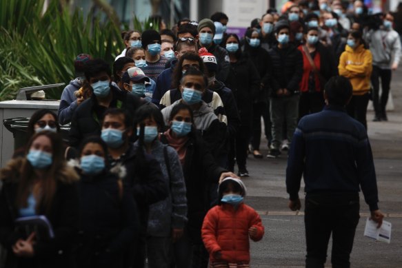 Queues of people outside the mass vaccination hub at Sydney Olympic Park on Sunday.