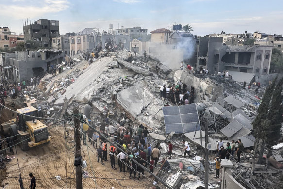 Palestinians look for survivors following Israeli airstrike in Nusseirat refugee camp overnight.