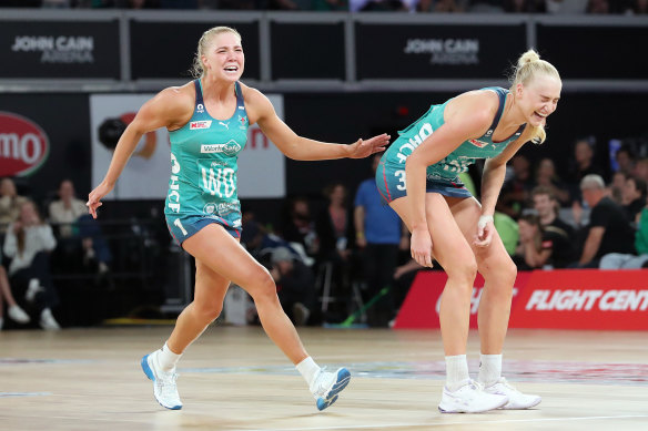 Vixens players Kate Moloney and Jo Weston celebrate their come-from-behind victory over the Collingwood Magpies at John Cain Arena.